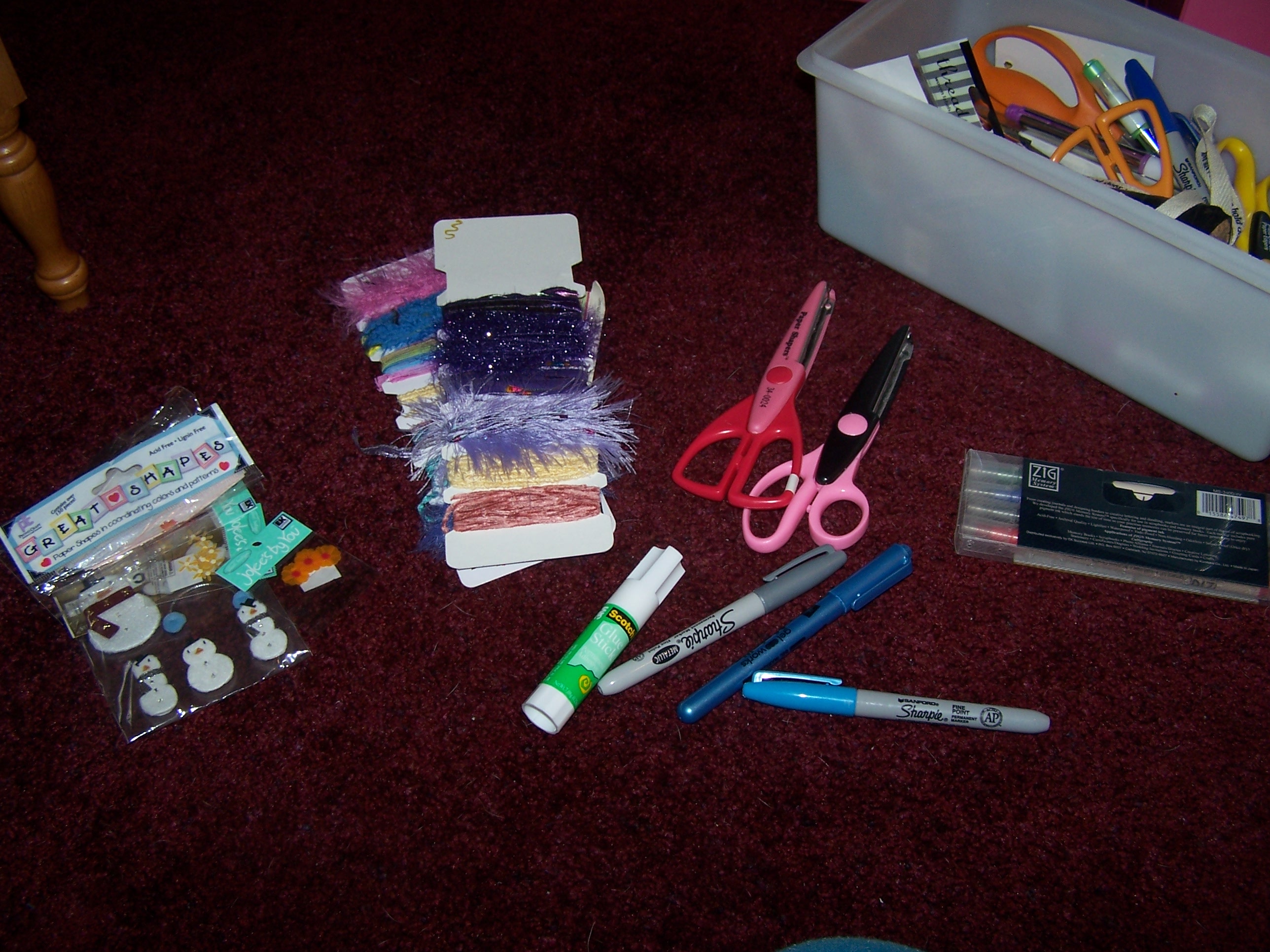 Here is just a glimpse of the plethora of supplies needed for scrapbooking.  Scissors, stickers, markers, pens, accessories, paper...
